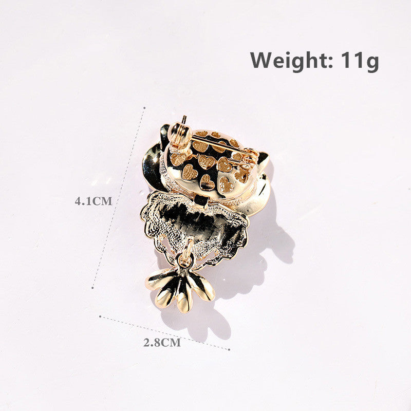 A gold and silver-toned metal flower-shaped accessory with rhinestone embellishments, shown on a white background with measurement lines and text indicating dimensions (4.1CM height, 2.8CM width.
